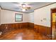 Bedroom featuring chair railing, a neutral wall, wood floors, and a ceiling fan at 237 Fea Ln, Iron Station, NC 28080