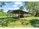 Open outbuilding on a green lot, perfect for equipment storage or outdoor projects, providing ample space at 237 Fea Ln, Iron Station, NC 28080