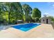 Inviting in-ground pool with surrounding patio, enclosed by a chain-link fence at 237 Fea Ln, Iron Station, NC 28080