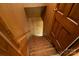 Stairwell featuring carpeted stairs and wood walls at 237 Fea Ln, Iron Station, NC 28080