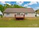Cozy home featuring a backyard and a wooden deck, perfect for outdoor relaxation and entertaining at 2412 Laura Dr, Charlotte, NC 28212