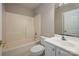 Bathroom features a shower-tub, a sink and large mirror at 2412 Laura Dr, Charlotte, NC 28212