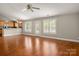 Inviting living area featuring hardwood floors, an open layout, and a view of the kitchen at 2412 Laura Dr, Charlotte, NC 28212