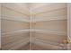Walk-in pantry featuring white wire shelving, offering ample storage space at 2412 Laura Dr, Charlotte, NC 28212