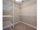 Walk-in closet fitted with white wire shelving for optimized storage at 2412 Laura Dr, Charlotte, NC 28212