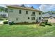 Expansive backyard featuring a well-maintained lawn, deck, and home exterior at 3119 Castlemaine Dr, Charlotte, NC 28269