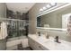 Modern bathroom with double sinks, marble accents in the shower, and contemporary lighting at 3119 Castlemaine Dr, Charlotte, NC 28269