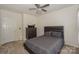 Bedroom featuring carpet, a queen bed, and a dark wood dresser with mirror at 3119 Castlemaine Dr, Charlotte, NC 28269