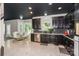 Open kitchen and dining area featuring modern finishes and dark cabinetry for a sleek design at 3119 Castlemaine Dr, Charlotte, NC 28269