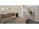Cozy living room with hardwood floors, neutral paint, and stairs leading up to the second floor at 3119 Castlemaine Dr, Charlotte, NC 28269