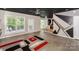 Open-concept living area leading to kitchen and dining, featuring modern accents and natural light at 3119 Castlemaine Dr, Charlotte, NC 28269