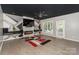 Bright living area with modern fireplace, TV, and large windows for ample natural light at 3119 Castlemaine Dr, Charlotte, NC 28269