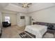Serene main bedroom with tray ceiling, carpeting, accent chair, and ample natural light at 3119 Castlemaine Dr, Charlotte, NC 28269