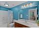 Bright bathroom featuring a vanity, toilet, and bathtub with a shower at 3124 Lakewood Edge Dr, Charlotte, NC 28269