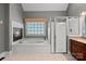 An ensuite bathroom featuring a fireplace, soaking tub, and a large walk-in shower at 3124 Lakewood Edge Dr, Charlotte, NC 28269