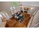 Elevated view of the living room with fireplace, staircase, and large windows offering ample natural light at 3124 Lakewood Edge Dr, Charlotte, NC 28269