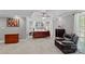A spacious main bedroom with a ceiling fan, neutral walls, carpet, and a comfortable sitting area at 3124 Lakewood Edge Dr, Charlotte, NC 28269