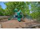 Playground featuring slides, climbing structures, and monkey bars with views of the beautiful community lake at 3124 Lakewood Edge Dr, Charlotte, NC 28269