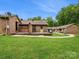 View of backyard and property featuring outdoor seating on a well-maintained lawn at 3164 Devonshire Dr, Rock Hill, SC 29732