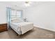 Comfortable bedroom with a large window, soft carpeting, and a full-sized bed creating a relaxing retreat at 3164 Devonshire Dr, Rock Hill, SC 29732
