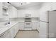 Bright, white kitchen with modern appliances and ample cabinet space for a clean aesthetic at 3164 Devonshire Dr, Rock Hill, SC 29732