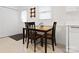 Bright kitchen nook with dark wood table and chairs, illuminated by natural light at 3164 Devonshire Dr, Rock Hill, SC 29732