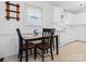 Bright kitchen nook with dark wood table and chairs, illuminated by natural light at 3164 Devonshire Dr, Rock Hill, SC 29732