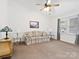 Spacious living room featuring plush carpeting, a ceiling fan, and tasteful decor creating a cozy atmosphere at 3164 Devonshire Dr, Rock Hill, SC 29732