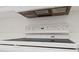 Close up of stovetop and vent in a clean, white kitchen at 3164 Devonshire Dr, Rock Hill, SC 29732