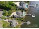 Aerial view showcasing multiple properties with in-ground pools and private boat docks on the waterfront at 3507 Governors Island Dr, Denver, NC 28037