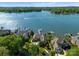 Stunning aerial view of lakefront homes with private docks on a sunny day at 3507 Governors Island Dr, Denver, NC 28037