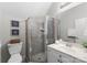 Clean bathroom with glass-enclosed shower, white vanity, and neutral decor at 3507 Governors Island Dr, Denver, NC 28037