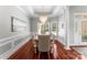 Elegant dining room with wainscoting, tray ceiling, and stylish chandelier at 3507 Governors Island Dr, Denver, NC 28037