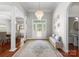 Elegant foyer with hardwood floors, stylish chandelier, and decorative accents at 3507 Governors Island Dr, Denver, NC 28037