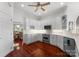 Well-lit kitchen with stainless steel appliances, white cabinets, and ample counter space at 3507 Governors Island Dr, Denver, NC 28037