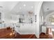 Modern kitchen with white cabinetry, stainless steel appliances, and a breakfast bar with stylish seating at 3507 Governors Island Dr, Denver, NC 28037