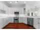 Bright kitchen with white cabinetry, stainless steel appliances, and ample counter space at 3507 Governors Island Dr, Denver, NC 28037
