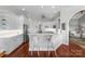 Modern kitchen with white cabinetry, stainless steel appliances, and a breakfast bar with stylish seating at 3507 Governors Island Dr, Denver, NC 28037