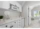 Well-lit kitchenette featuring white cabinets, countertop, and appliances at 3507 Governors Island Dr, Denver, NC 28037
