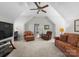 Spacious living room with vaulted ceilings, ceiling fan, and comfortable seating at 3507 Governors Island Dr, Denver, NC 28037