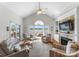 Spacious living room with vaulted ceiling, fireplace, and sliding doors with water views at 3507 Governors Island Dr, Denver, NC 28037