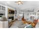 Open living space with fireplace, built-ins, and a view into the modern kitchen at 3507 Governors Island Dr, Denver, NC 28037