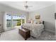 Bedroom featuring neutral walls, carpet, and lake views at 3507 Governors Island Dr, Denver, NC 28037