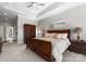Bedroom featuring carpet, a large bed, and a wooden cabinet at 3507 Governors Island Dr, Denver, NC 28037