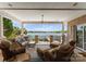 Covered patio with comfortable seating overlooking the water view at 3507 Governors Island Dr, Denver, NC 28037