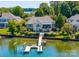This waterfront home features a lovely backyard pool and private dock access to the lake at 3507 Governors Island Dr, Denver, NC 28037