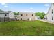 A large backyard features a freshly cut lawn and view of the back of the home at 355 Jared Steel Ln, Salisbury, NC 28146