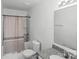 Neutral bathroom featuring a shower with curtain, toilet, granite vanity, and modern mirror at 355 Jared Steel Ln, Salisbury, NC 28146