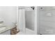 Clean bathroom featuring a shower with curtain, granite vanity, and shelving with rolled white towels for storage at 355 Jared Steel Ln, Salisbury, NC 28146