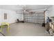 Spacious garage with sealed concrete floor, garage door opener, ample storage, and room for multiple vehicles at 355 Jared Steel Ln, Salisbury, NC 28146